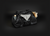 Black duffel bag with various items on a black background