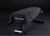 Black exercise bench with a cover draped over it on a dark background, featuring the YOUNIX brand.
